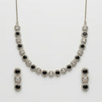 Zehra Onyx Halo Necklace Set necklace with matching earrings, studio flatlay