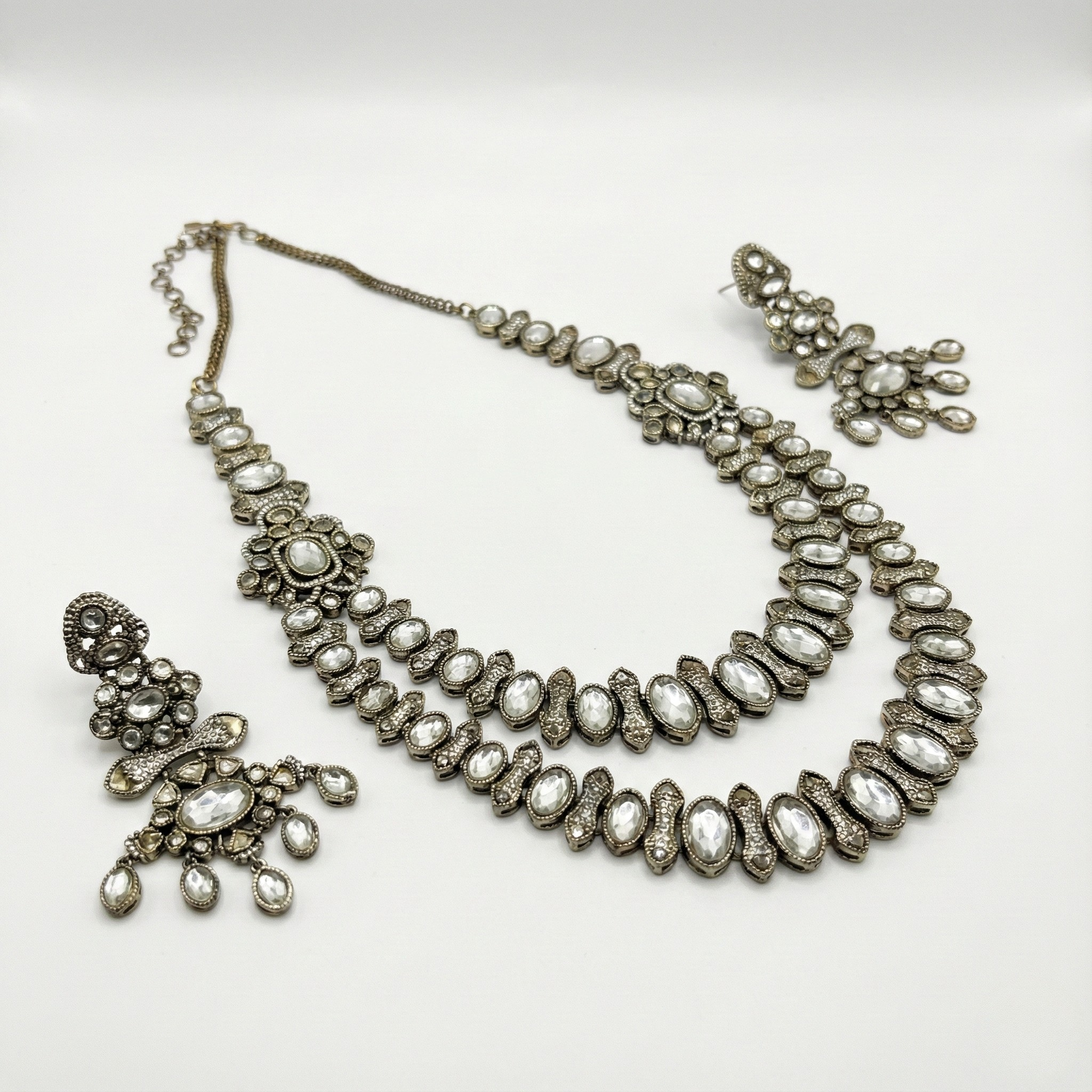 South Asian woman wearing the silver-tone crystal statement necklace — bridal look