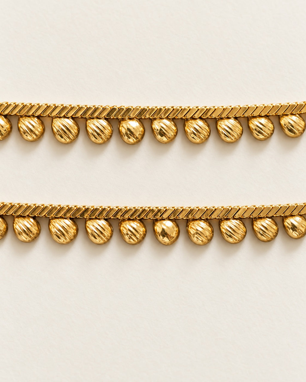 Matching Rani Droplet Anklet pair detail, gold-tone chain with droplet charms