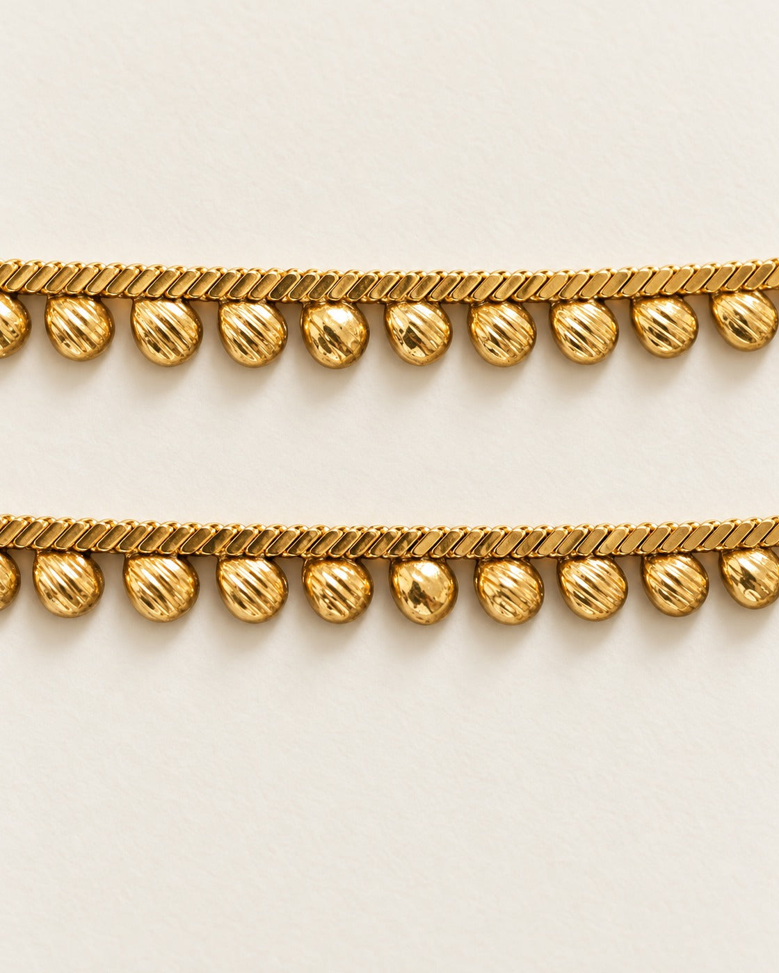 Matching Rani Droplet Anklet pair detail, gold-tone chain with droplet charms