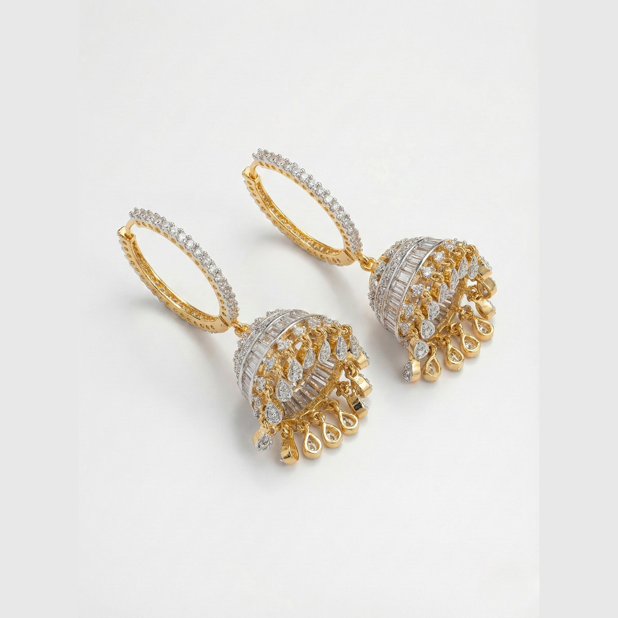 Sona-Ivory Halo Jhumkas detail showing pavé hoop, baguette band, and teardrop charms on the bell