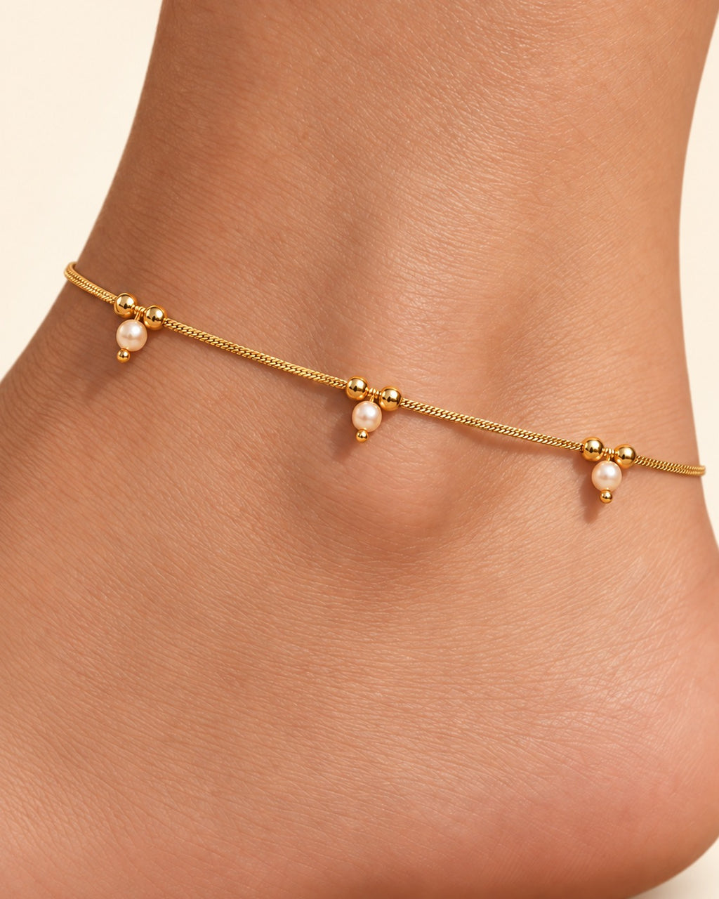 Close detail of Sia Pearl Anklets with pearl drops and bead details