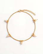 Sia Pearl Anklet laid in an oval, gold-tone chain with cream pearl drops, 2 inch extension and lobster clasp