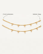 Flat lay of matching Sia Pearl Anklets with labeled 2 inch extension and lobster clasp