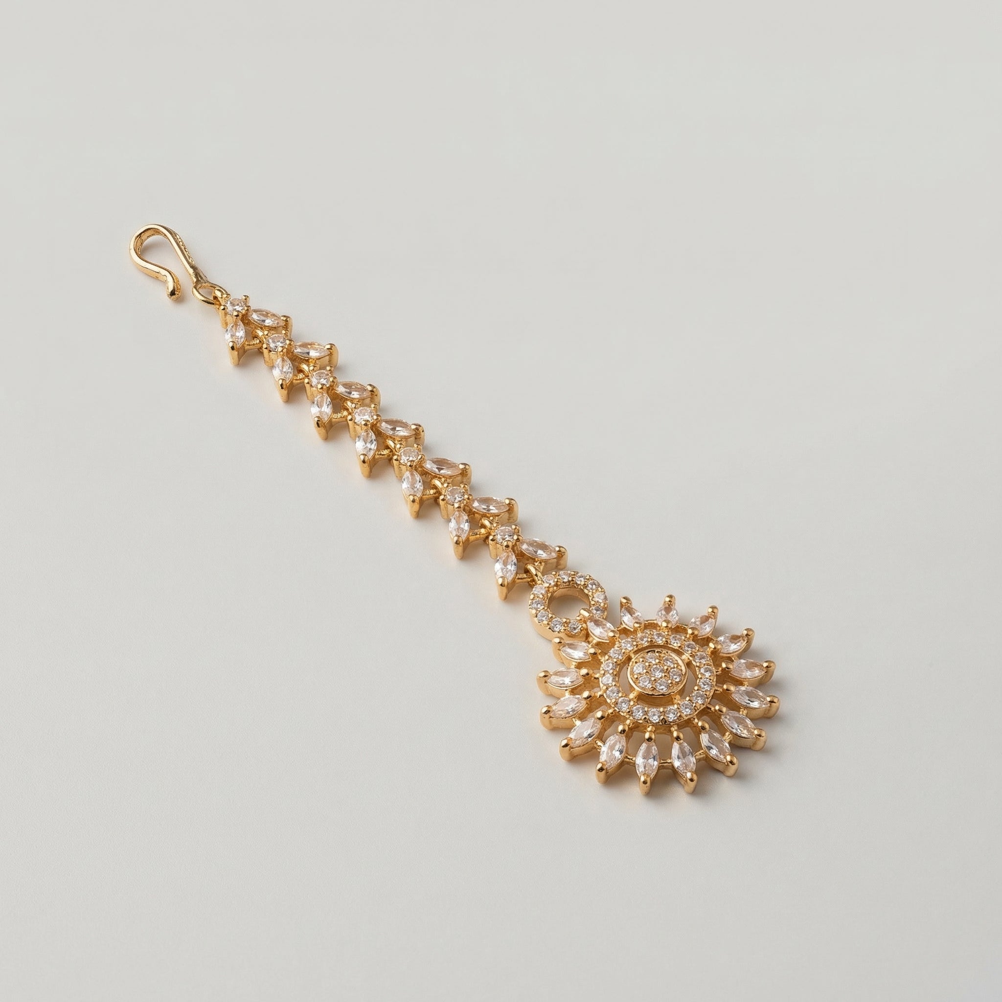 Kiran Tikka detail showing marquise link strand and pavé sunburst centerpiece
