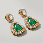 Panna Kiran Earrings detail showing scalloped halo and green center stone