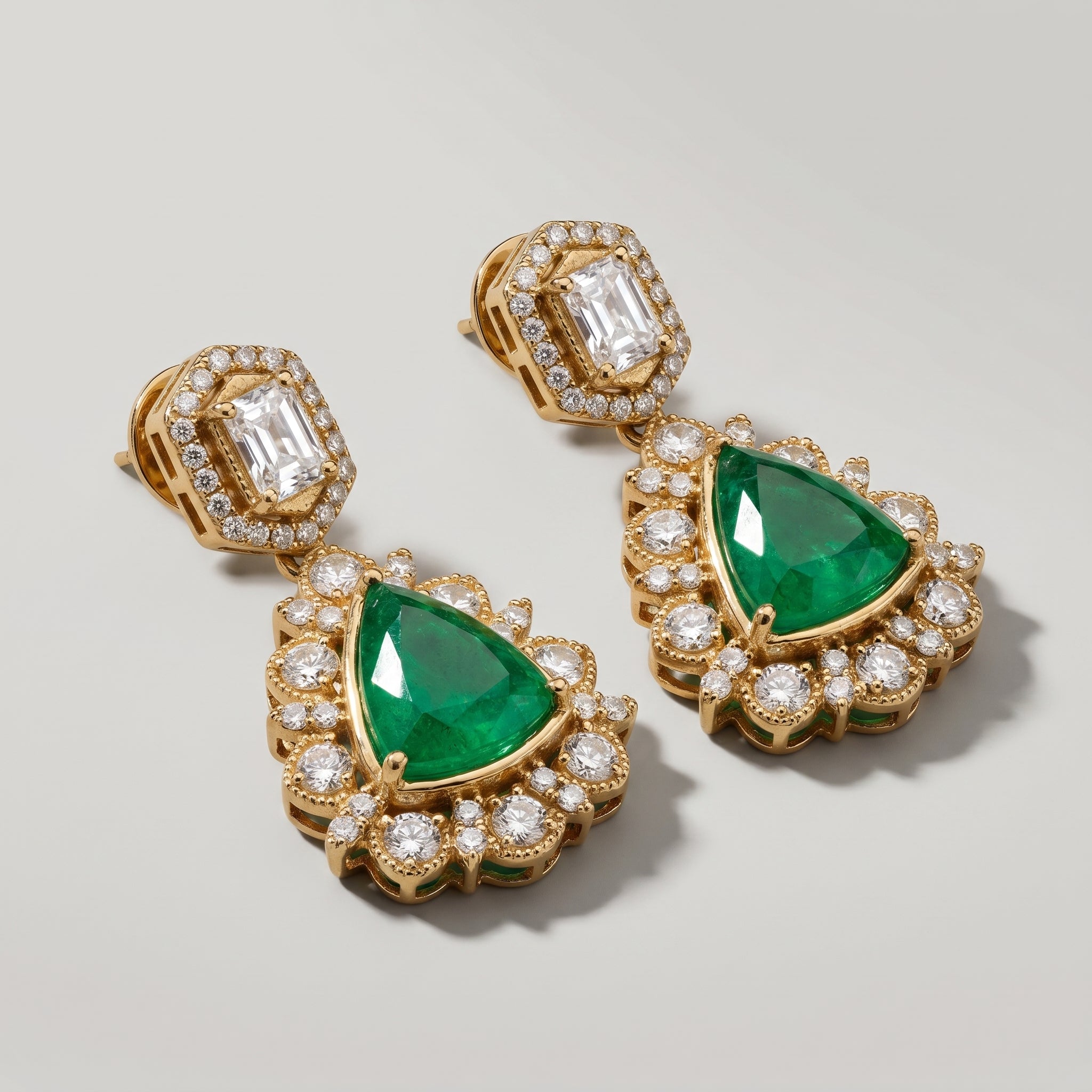 Panna Kiran Earrings detail showing scalloped halo and green center stone