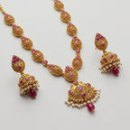 Ruby Pearl Earrings detail showing ruby leaf stud, filigree bell band, and center ruby drop