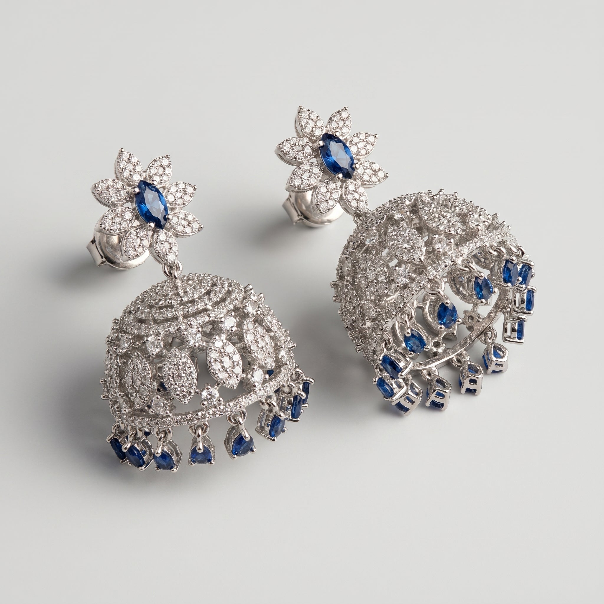 Neelam Jhumka Earrings detail showing floral blue stud and domed bell