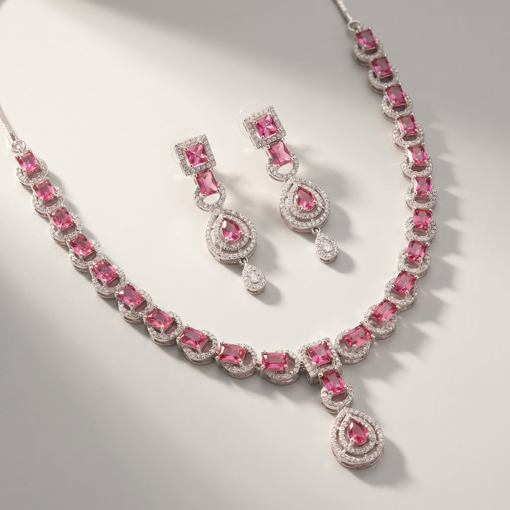Rani Ruby Necklace Set detail of ruby pear drop pendant and crystal halo setting