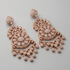 Roshni Earrings detail showing sunburst floral center, heart filigree tiers, and pavé crystal dangles