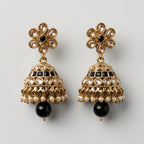 Moti Jhumka Earrings detail showing champagne floral top black stone bands and pearl fringe drop