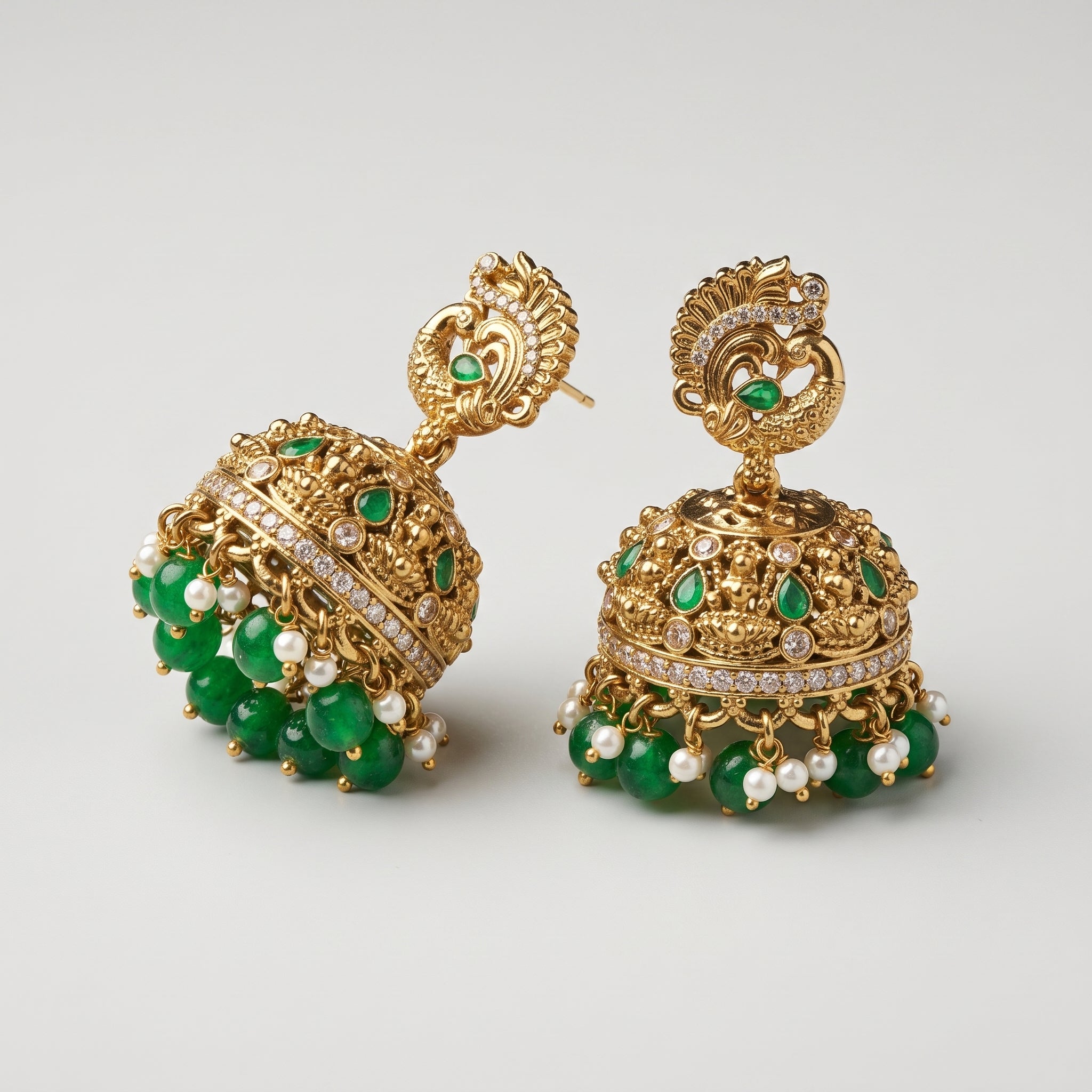 Mayuri Moti Earrings detail showing peacock top filigree dome and emerald pearl dangle fringe