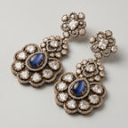 Neelam Bloom Earrings detail showing midnight blue cat's eye center, rose-cut crystal petals, and floral pavé halo