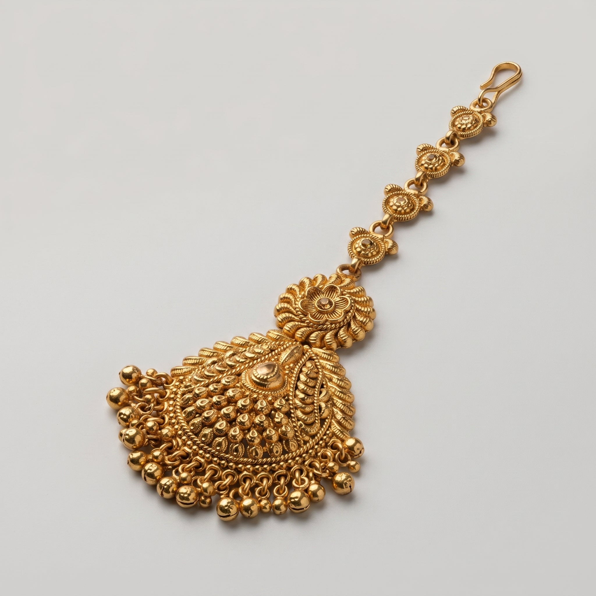 Rani Flora Tikka detail showing scalloped link chain and openwork fan pendant