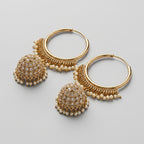 Kundan Moti Earrings detail showing pearl-lined hoop and filigree jhumka with clear stones