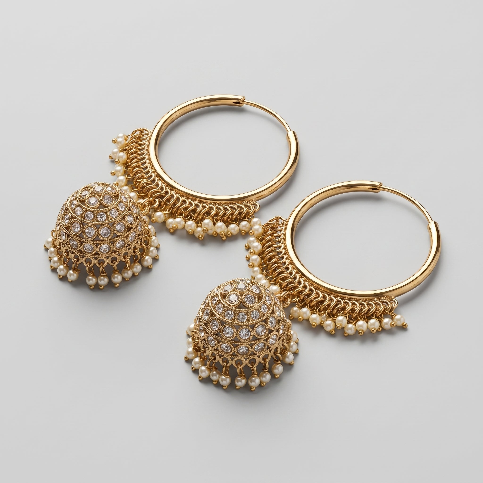 Kundan Moti Earrings detail showing pearl-lined hoop and filigree jhumka with clear stones