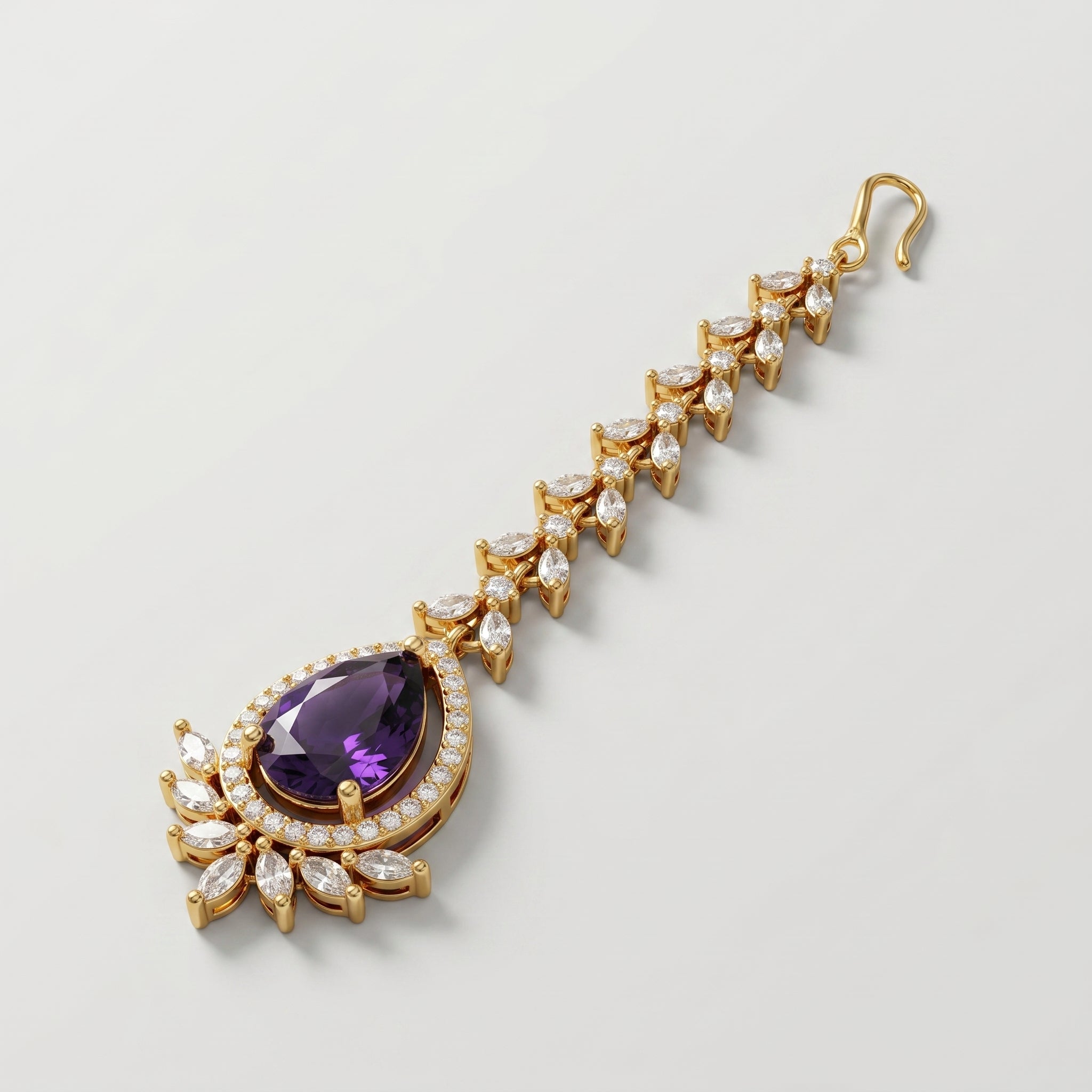 Rani Amethyst Tikka gold-tone maang tikka with purple pear pendant on gray background