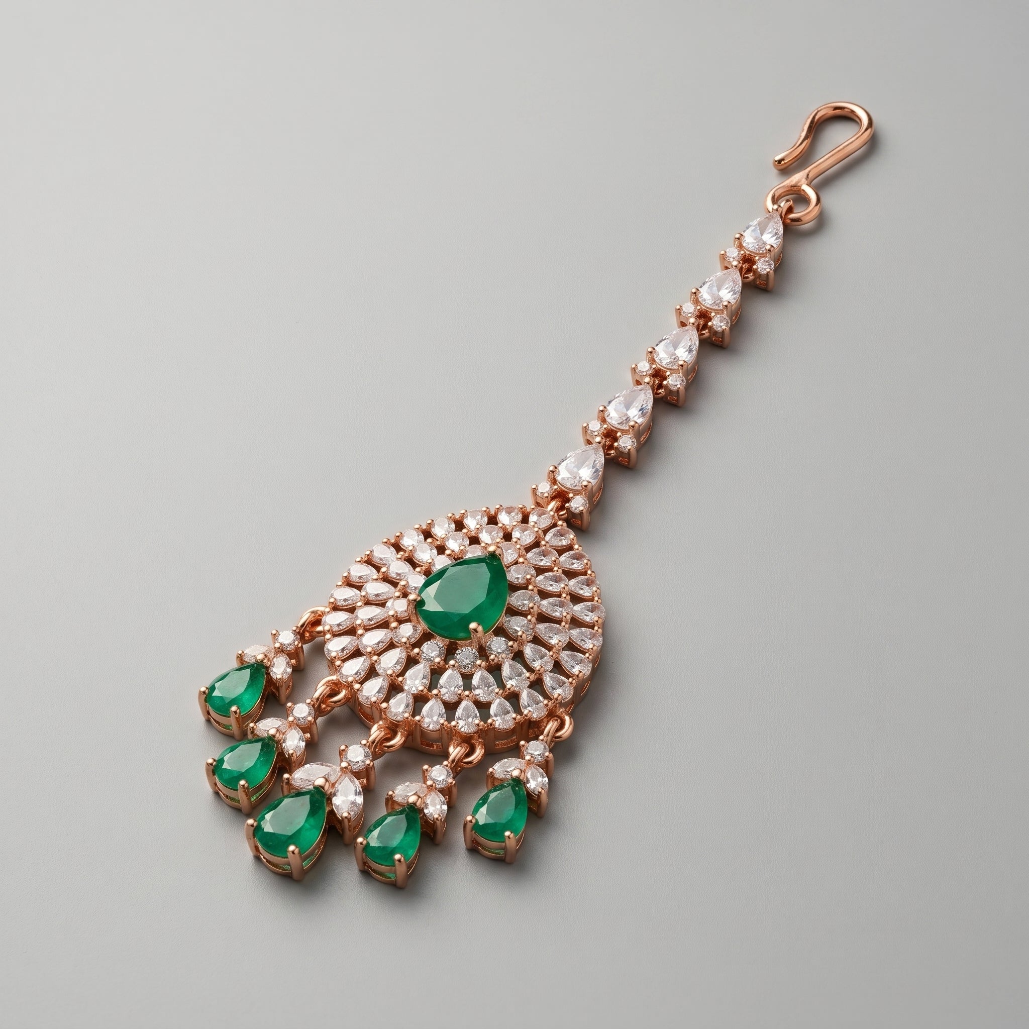 Panna Tikka detail showing green stone pendant and crystal teardrop chain