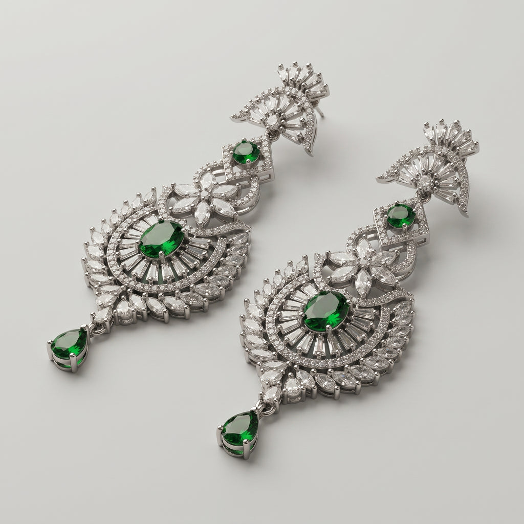 Divya Emerald Earrings detail showing baguette fan top sunburst medallion and green pear drop