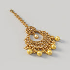 Golden Pearl Tikka detail showing crystal medallion and five pearl drops