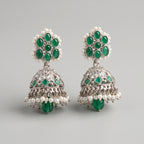 Rani Emerald Jhumka Earrings detail showing green cabochon stud, engraved bell, and pearl and emerald drops