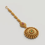 Kamal Floral Tikka detail showing pink teardrop connector and kamal pendant with green center stone