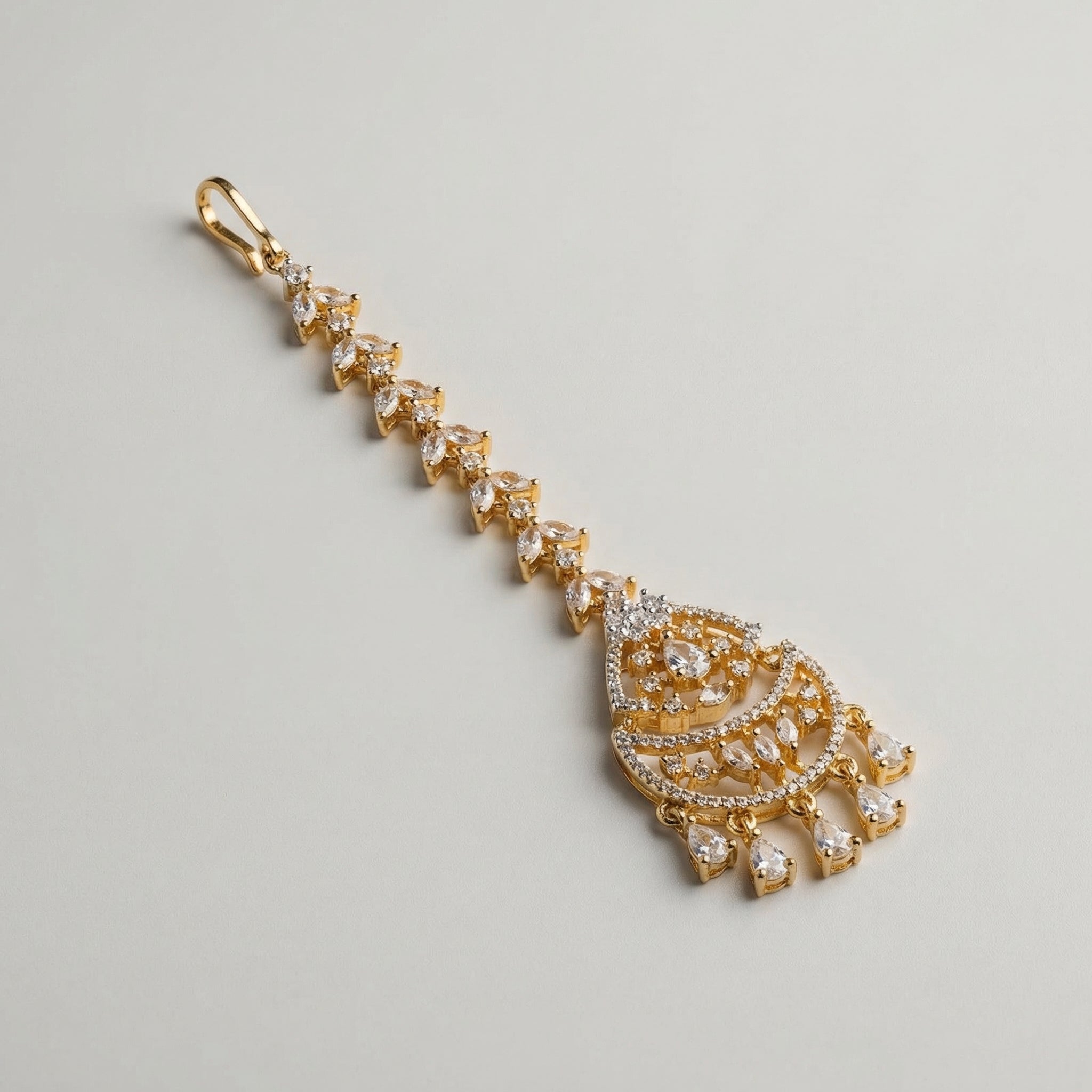 Kiara Dewdrop Tikka detail showing pavé crescent pendant and five teardrop crystal charms