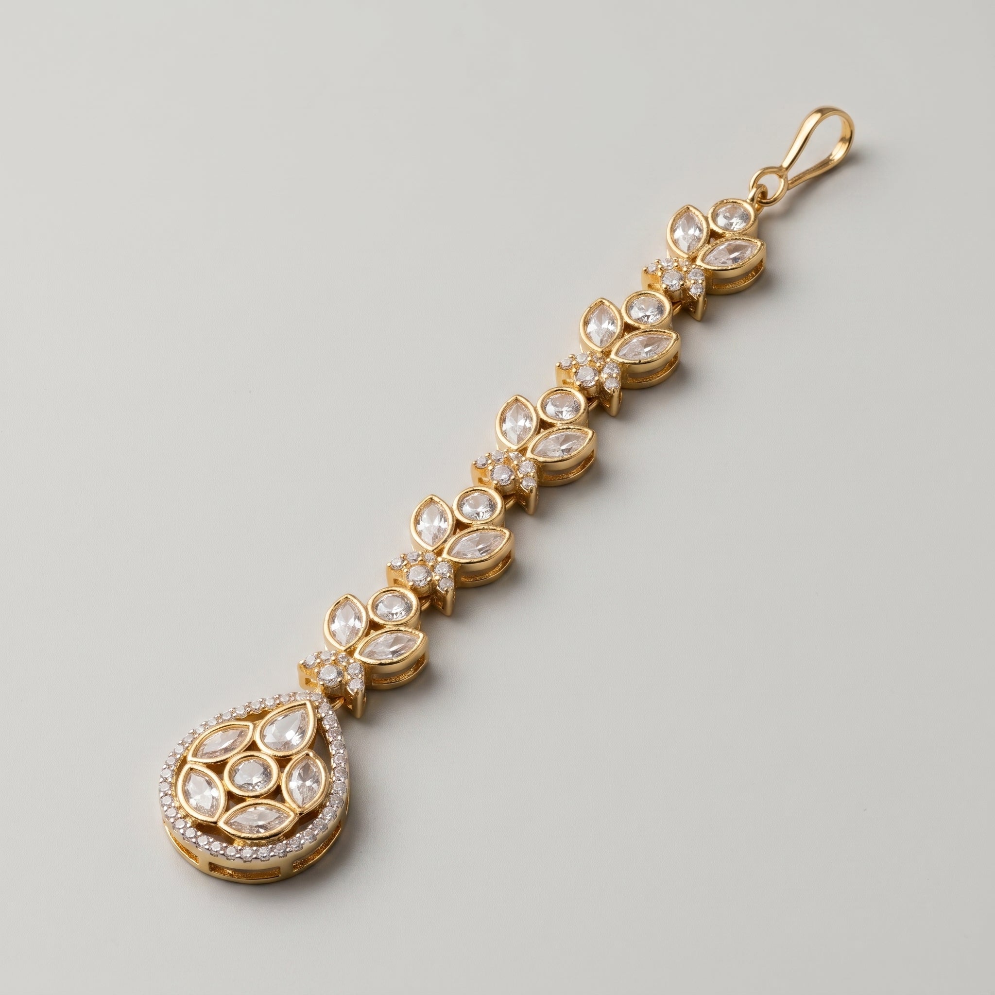 Kundan Crystal Tikka detail showing marquise crystal leaf links and pavé-bordered teardrop pendant