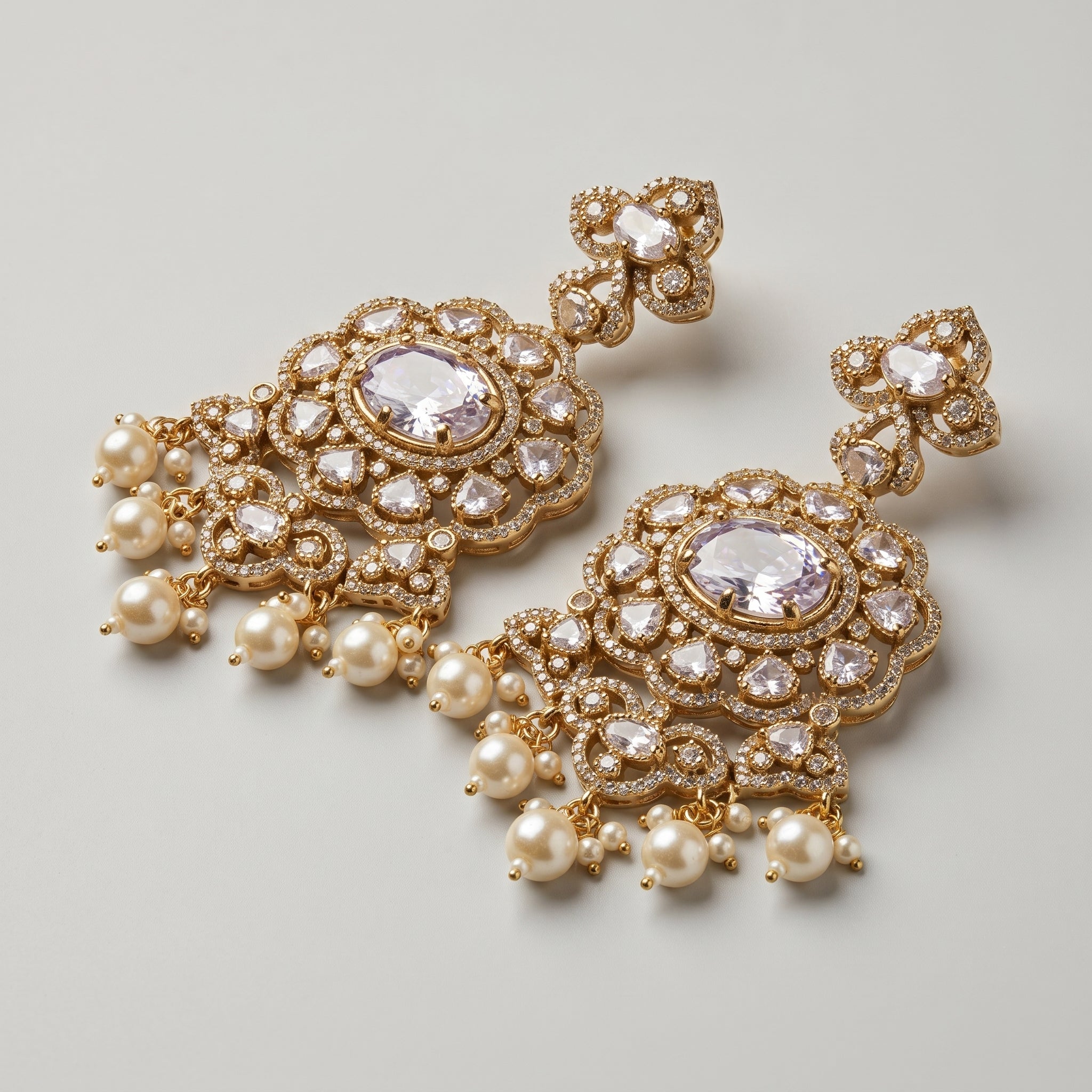 Rani Pearl Earrings detail showing lavender-purple oval center, polki crystal halo, and cream pearl dangles