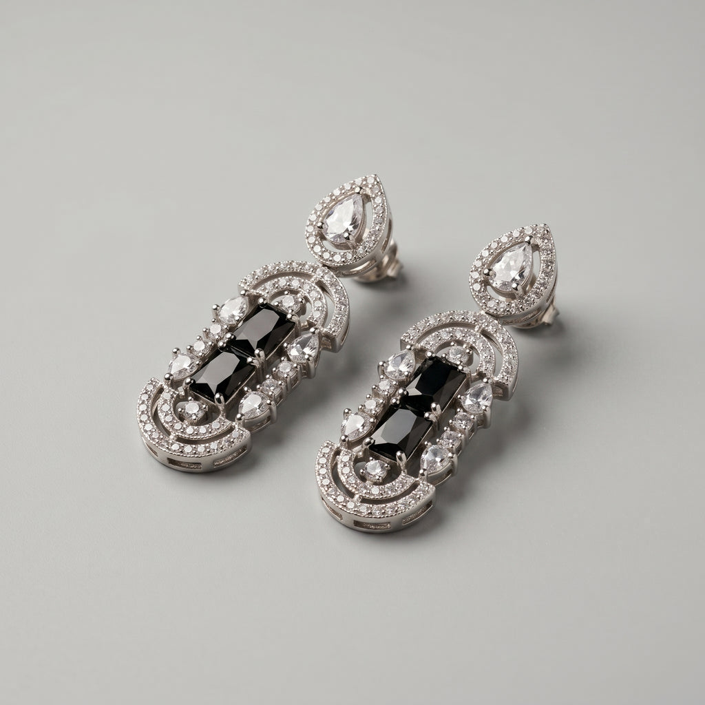 Aira Onyx Earrings detail showing stacked onyx center, pavé arches, and pear crystal accents
