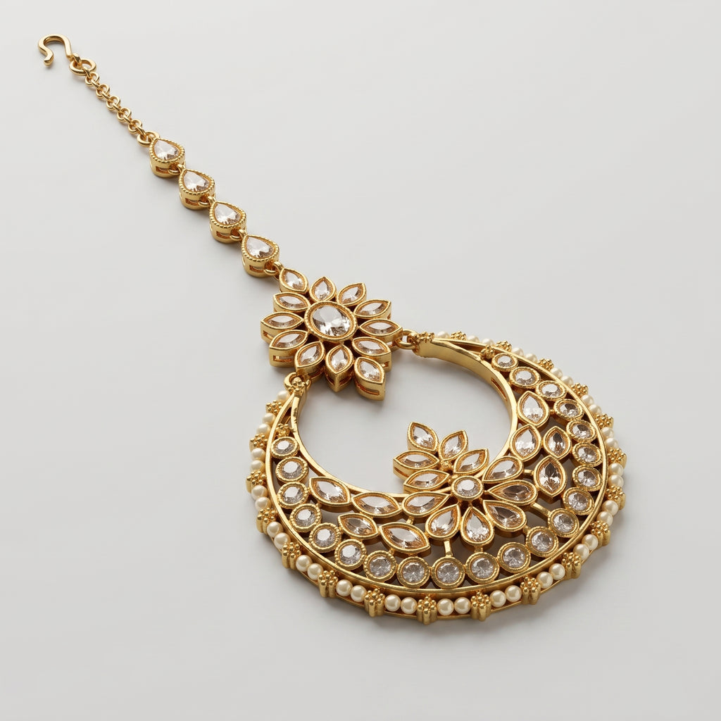 Kamal Crystal Tikka detail showing champagne teardrop chain links and pearl-lined crescent pendant