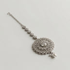 Mandala Crystal Tikka detail showing pear-cut crystal chain, mandala center, and pearl drop