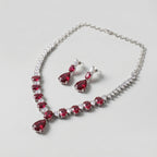 Rani Ruby Necklace Set detail of graduated ruby stones and clear teardrop accent border