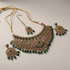 Majestic Emerald Choker Set detail showing emerald teardrop fringe and polki filigree