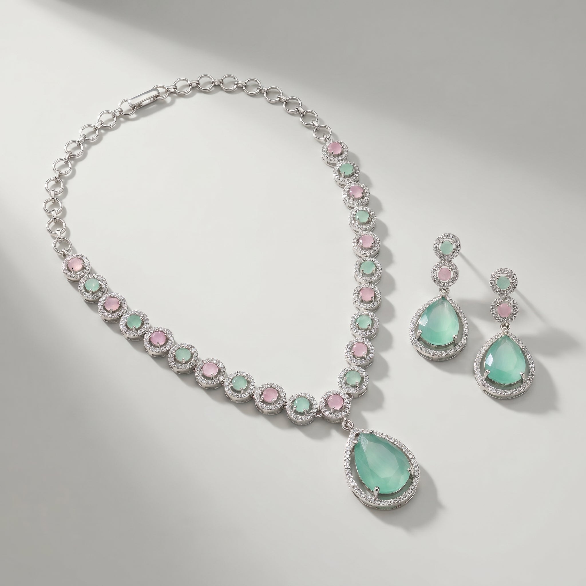 Aqua Rose Necklace Set detail of alternating pastel halo stones and pear aqua pendant
