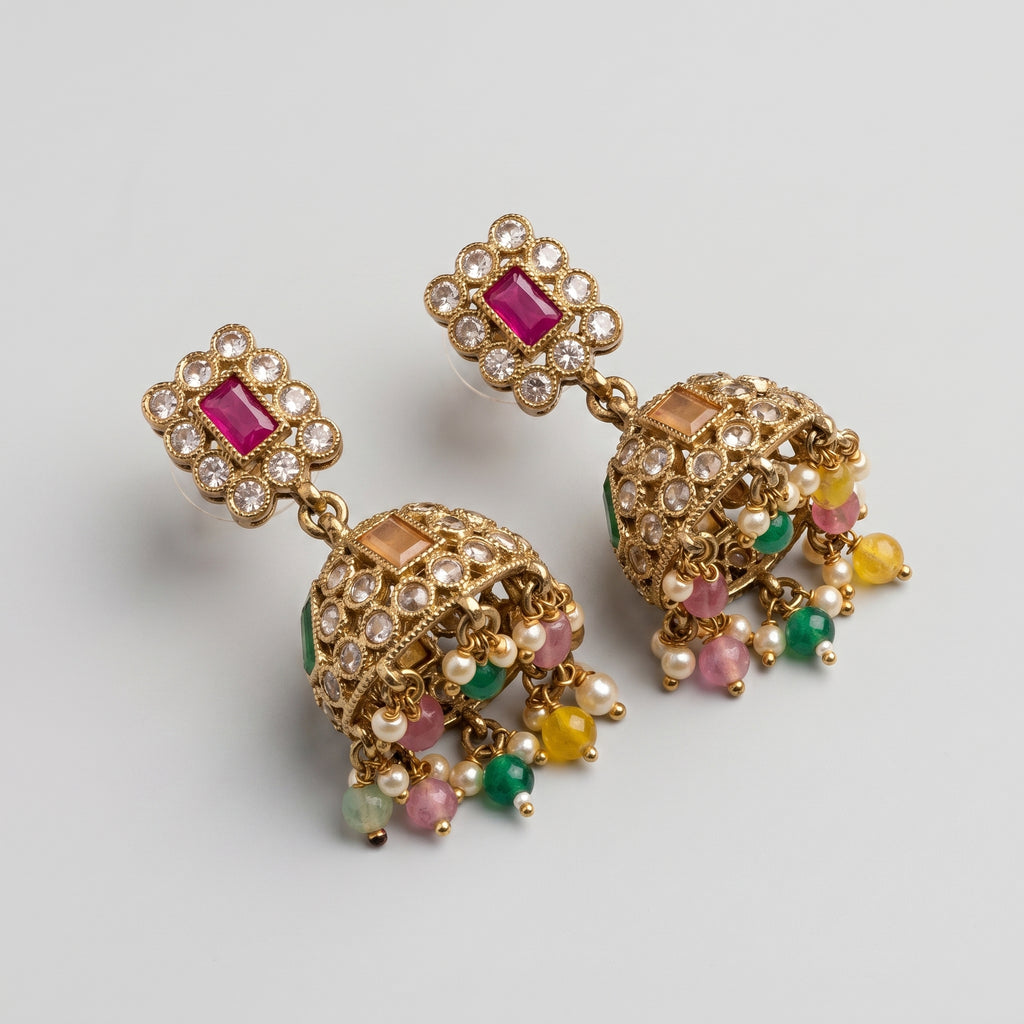 Kundan Earrings detail showing ruby rectangular stud orange and green dome stones and colored bead latkan
