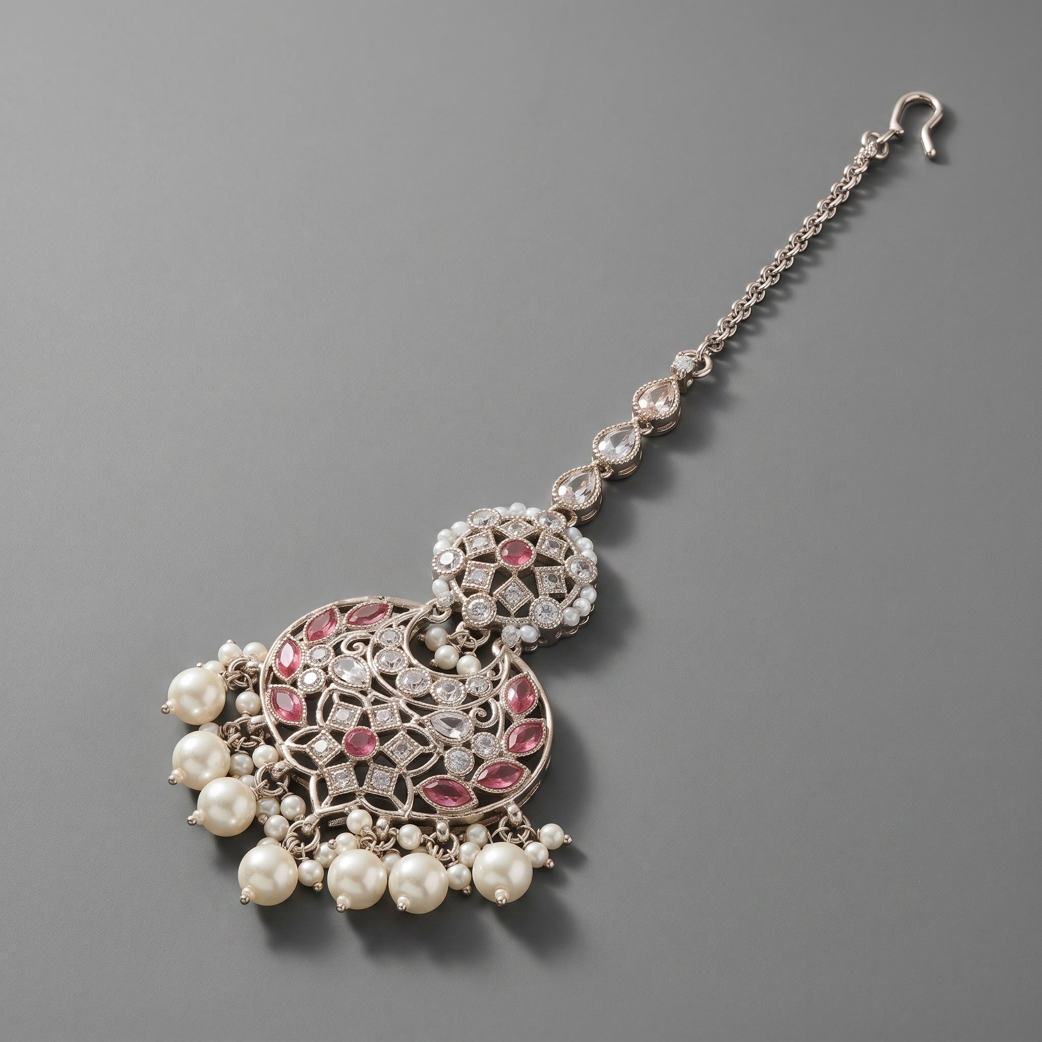 Gulabi Pearl Tikka detail showing pink marquise stones and nine-pearl crescent fringe