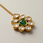Panna Jadau Tikka detail showing oval emerald-green stone and six clear teardrop kundan accents
