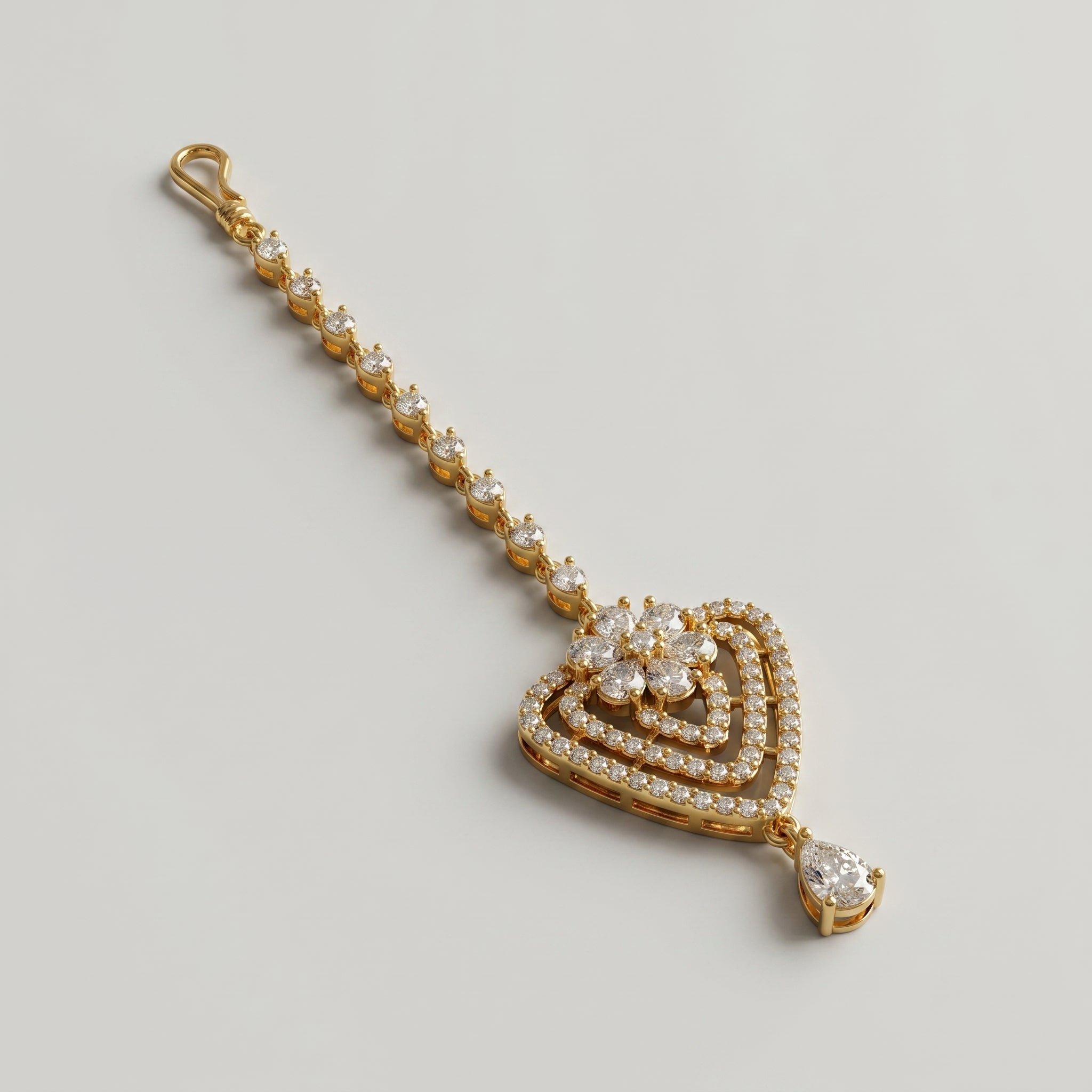 Golden Flora Tikka detail showing tiered pavé heart and bottom pear drop