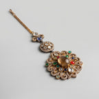 Navrang Tikka gold three-tier maang tikka with multicolor navratna cabochons on gray background