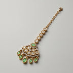 Kundan Pista Tikka detail showing green stone fan pendant and crystal borders