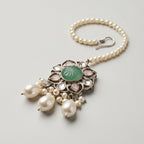 Firozi Pearl Tikka detail showing carved green floral pendant with pink teardrop stones and pearl dangles