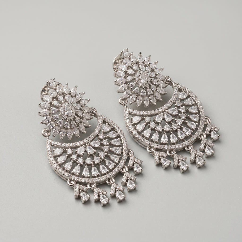 Chand Dazzle Earrings detail showing pavé crescent and dangling pears