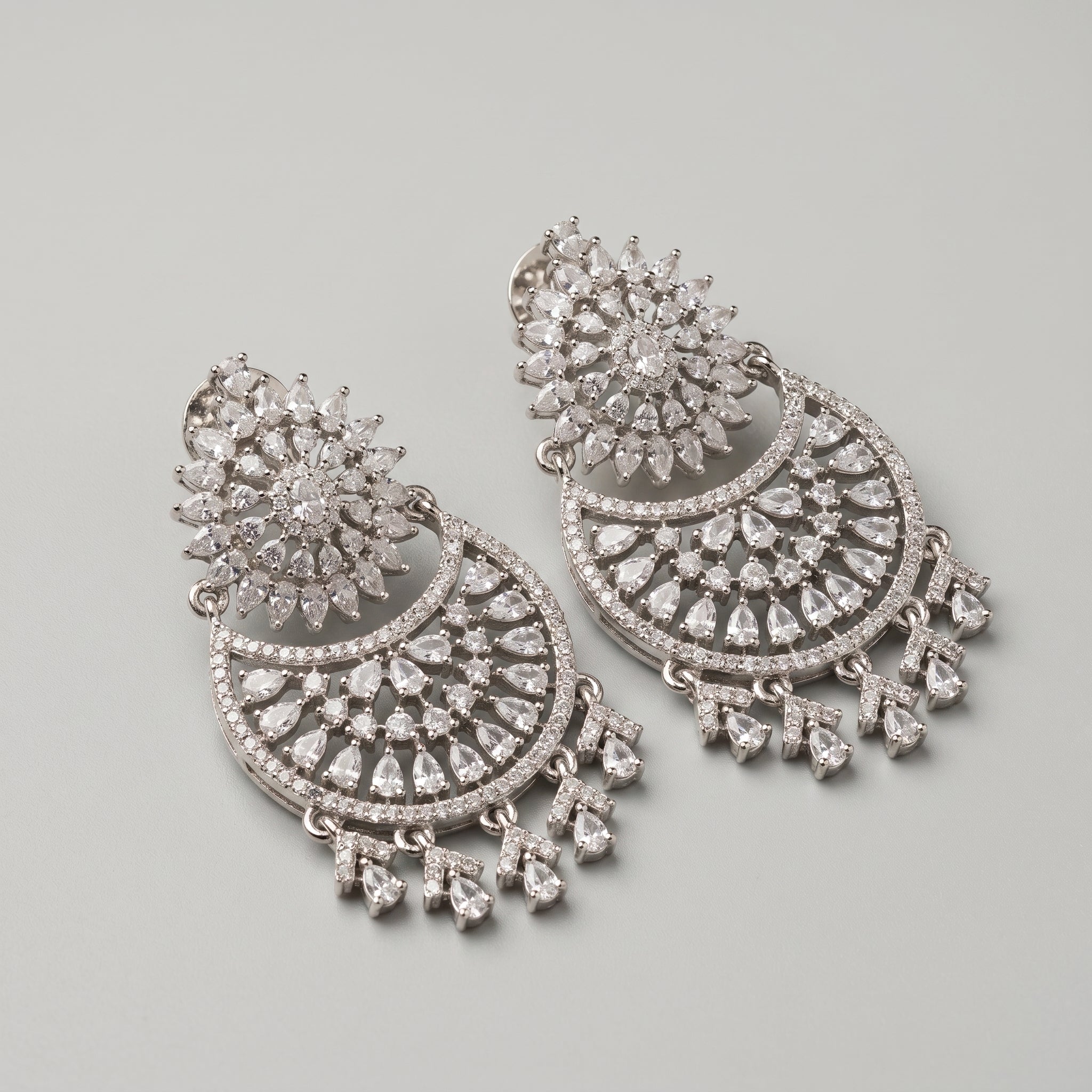 Chand Dazzle Earrings detail showing pavé crescent and dangling pears