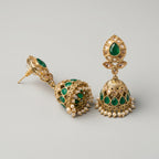 Panna Jhumka Earrings detail showing emerald-green teardrop stud, granulated bell dome, and seed-pearl ghungroo fringe