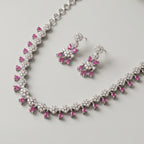Gulab Droplet Necklace Set detail of pavé floral clusters and ruby-pink fringe drops