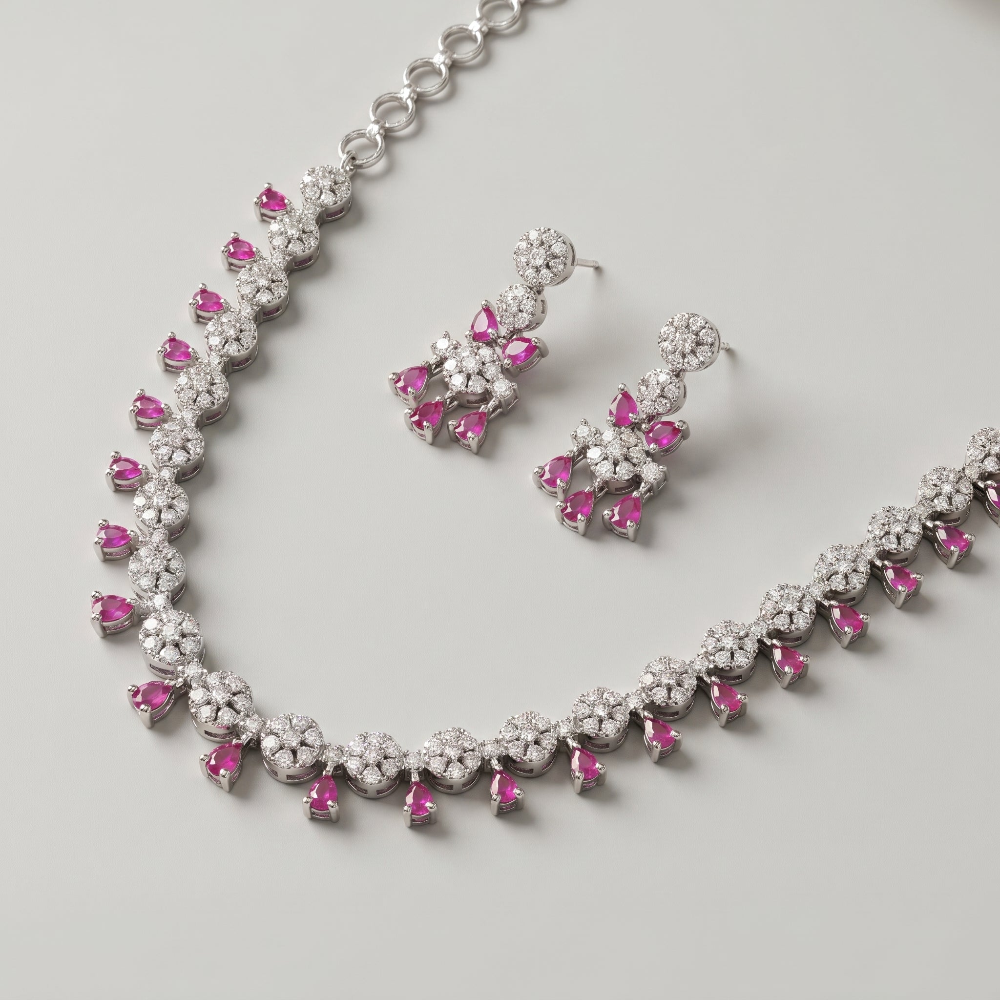 Gulab Droplet Necklace Set detail of pavé floral clusters and ruby-pink fringe drops