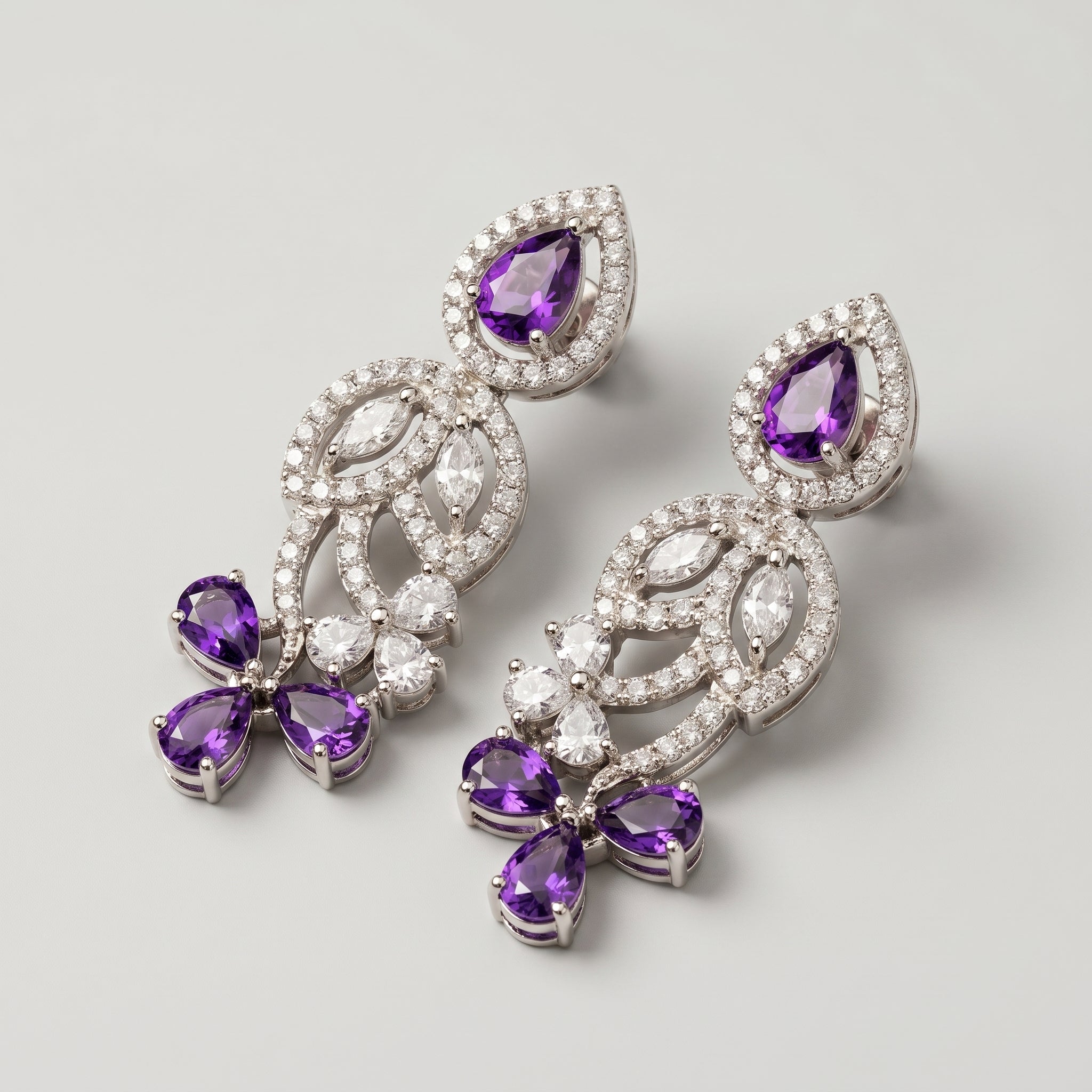 Pari Amethyst Earrings detail showing swirling filigree, marquise crystal leaves, and triple amethyst cluster
