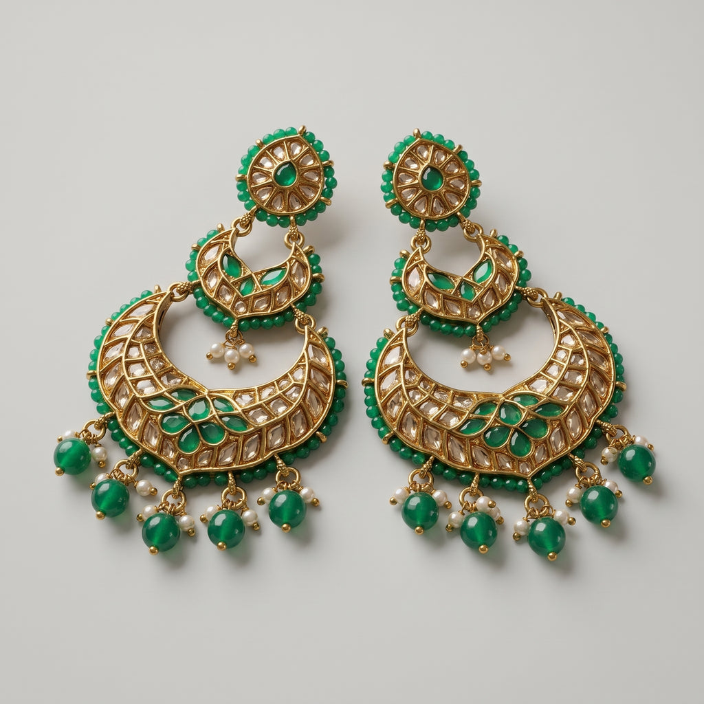 Jadau Panna Earrings detail showing tiered jali crescent, emerald teardrops, and pearl dangles